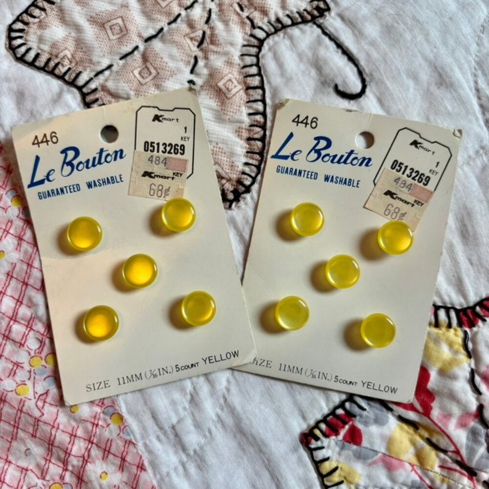 Vintage Le Bouton yellow shank buttons on their original cards. Set of two.